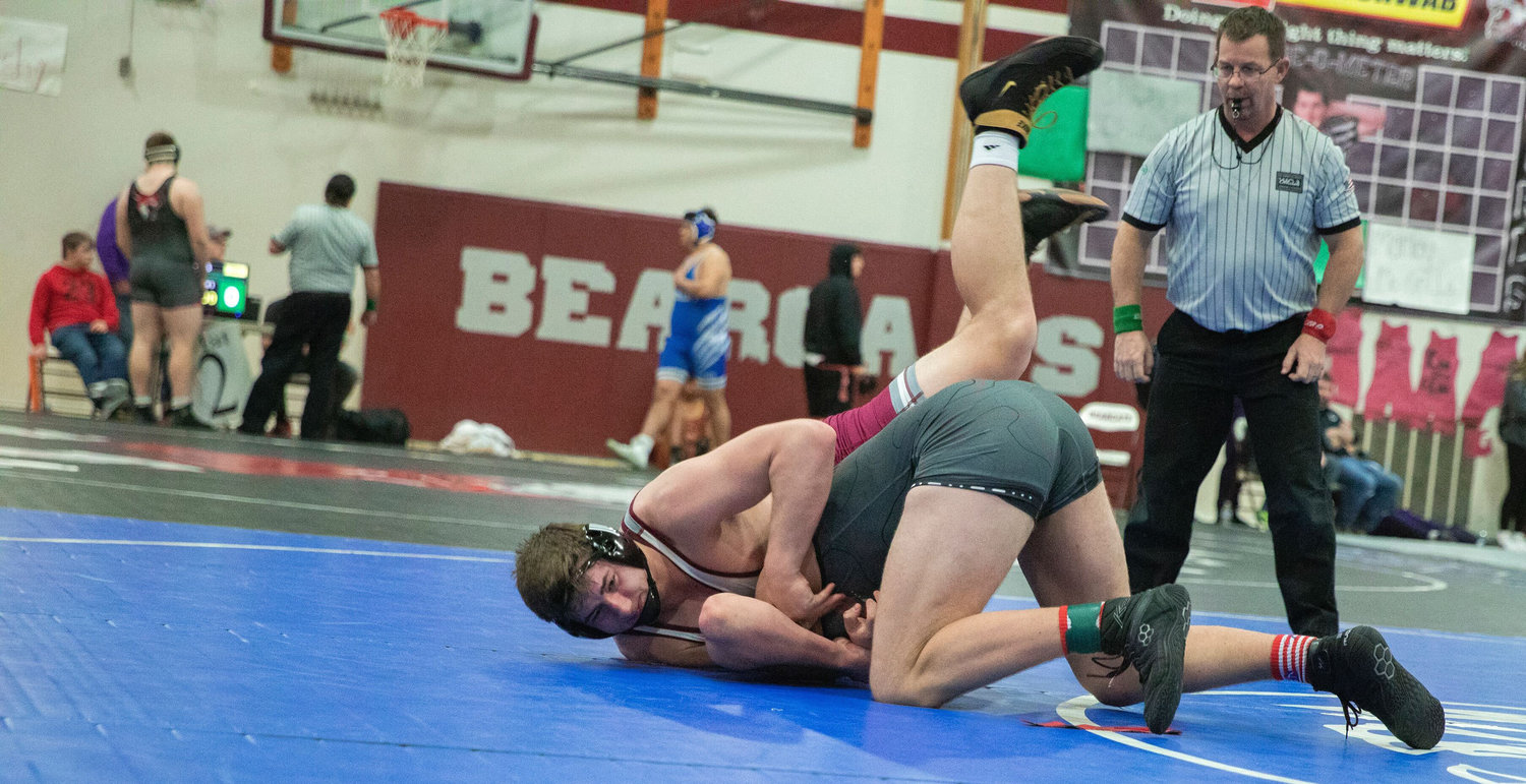 W.F. West’s Andrew Penland wrestles Frank Kissick from Mount Si during the Bearcat Invitational in Chehalis on Saturday.
